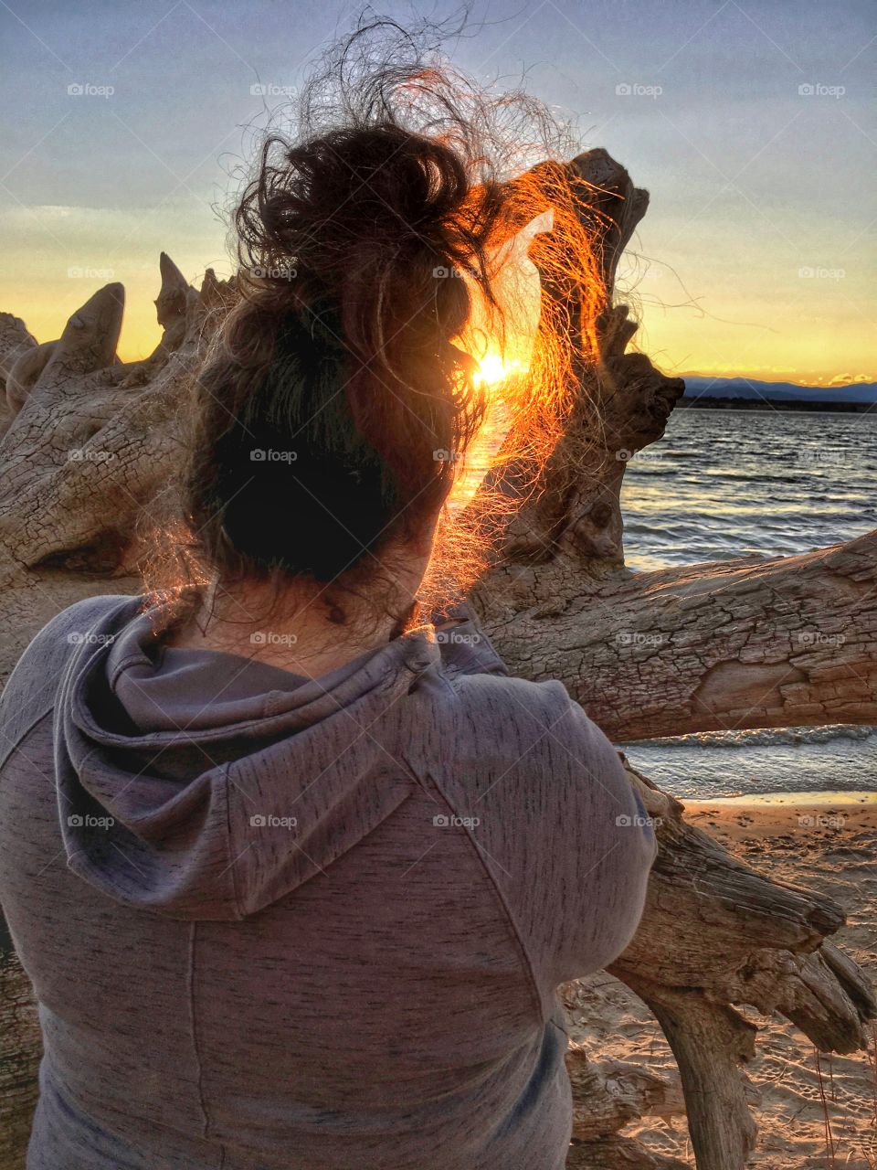 Sunset picture. Sun rays hair on “fire”