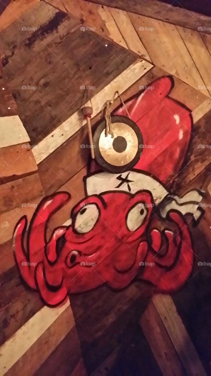 Drawing of an octopussy on a wood wall