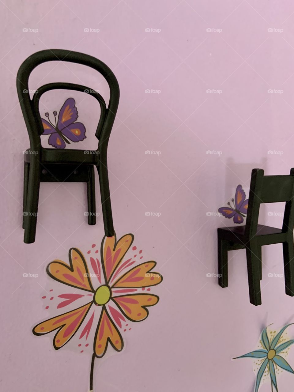 Clothes hangar made Like chairs 