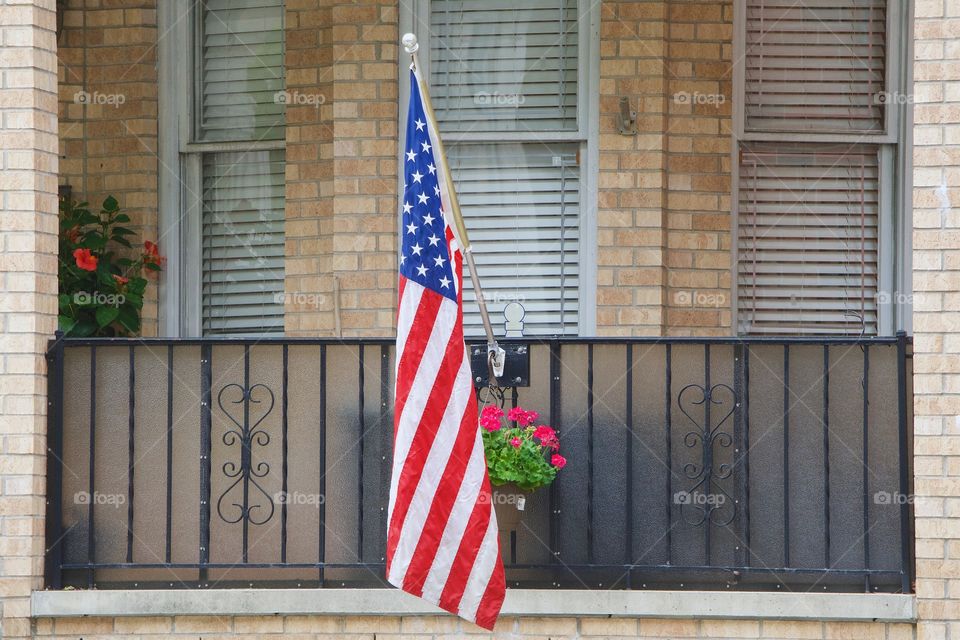 An American  flag on the front porch of a house in Brooklyn, New York City.