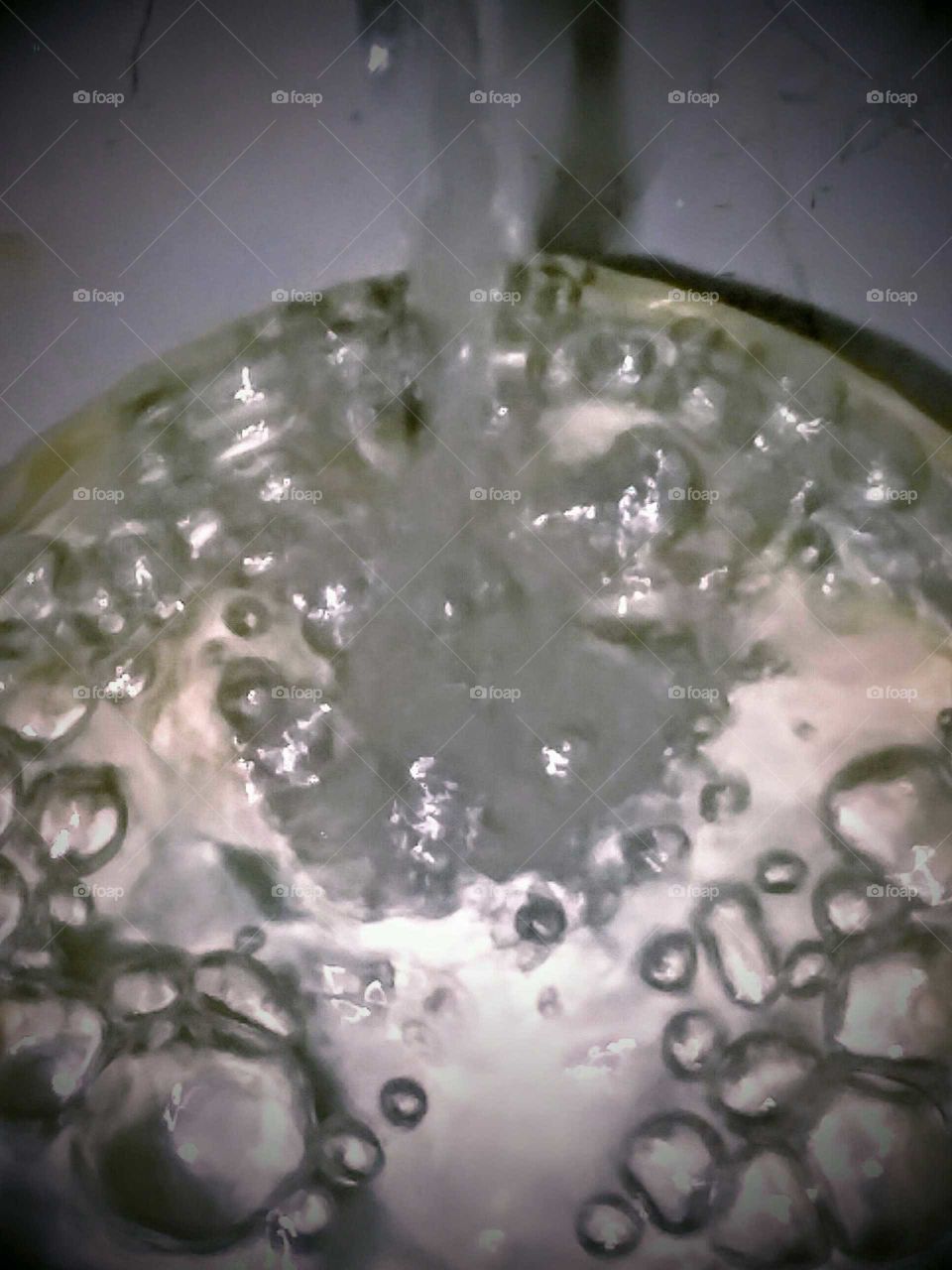 Trickle of Water Overflowing in a Mason Jar  (top view)