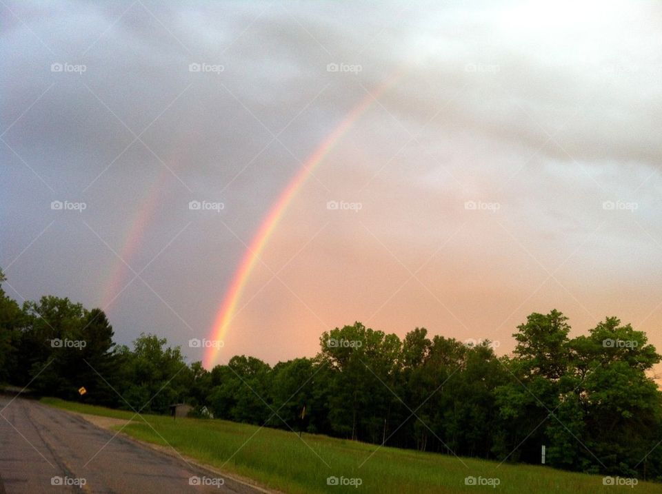 sky clouds rainbow rain by serenitykennedy