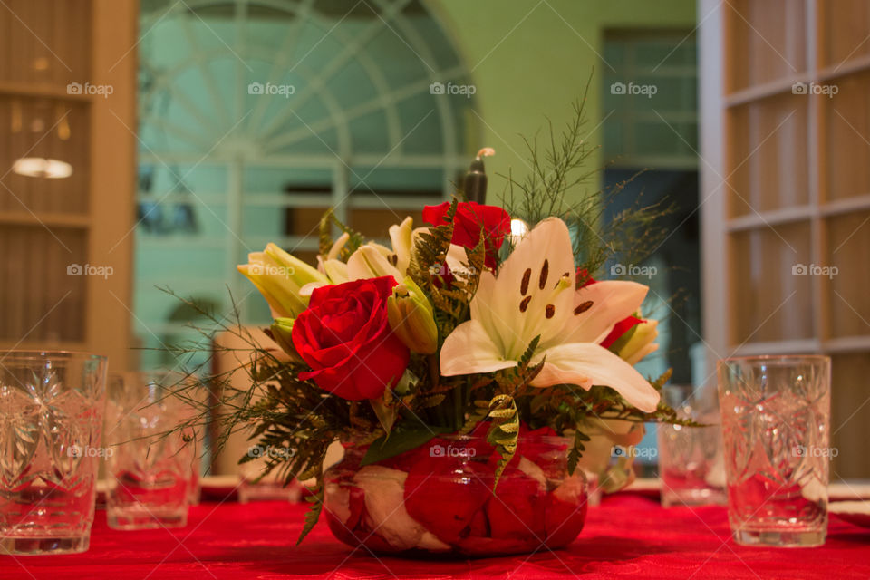 red roses on red tablecoth