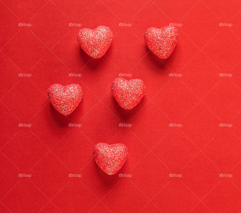 Red hearts on a red background. Valentine's Day. Postcard. Red pepper.