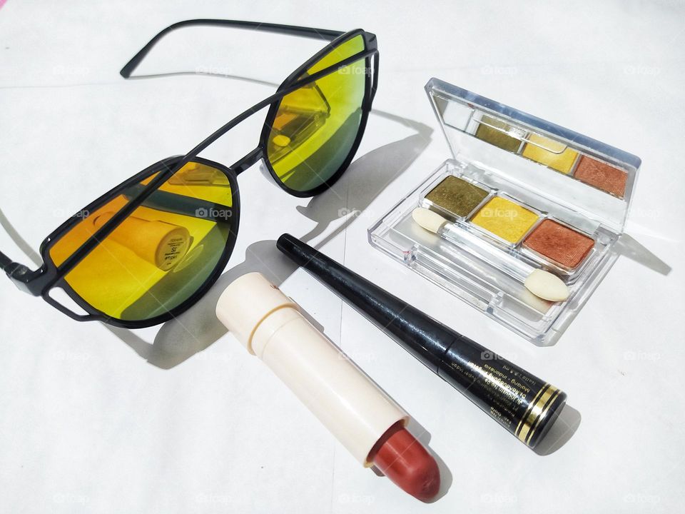 Sunglasses, lipstick, eyeliner, eyeshadow, isolated on white background, makeup tools