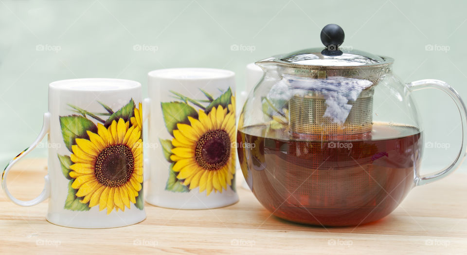 Black tea in glass teapot