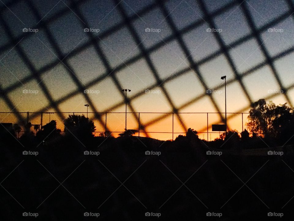 Sunset viewed through the racket