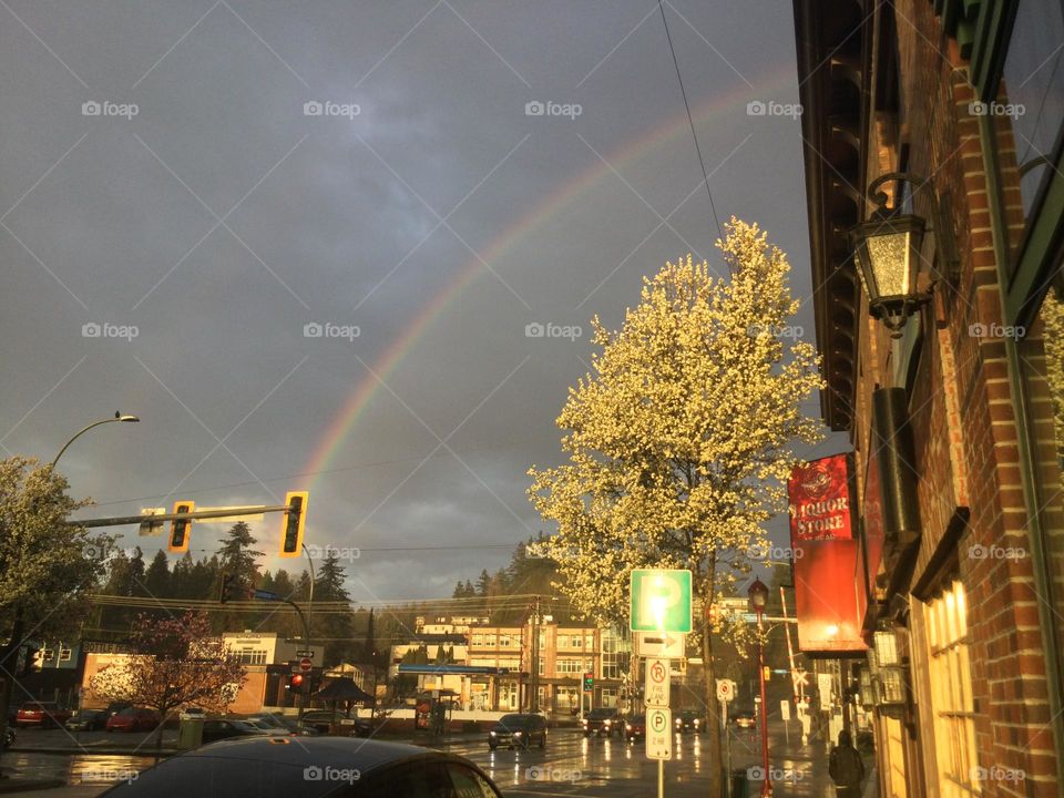 A Rainbow on a Stormy Day with the Sun Trying to poke through 