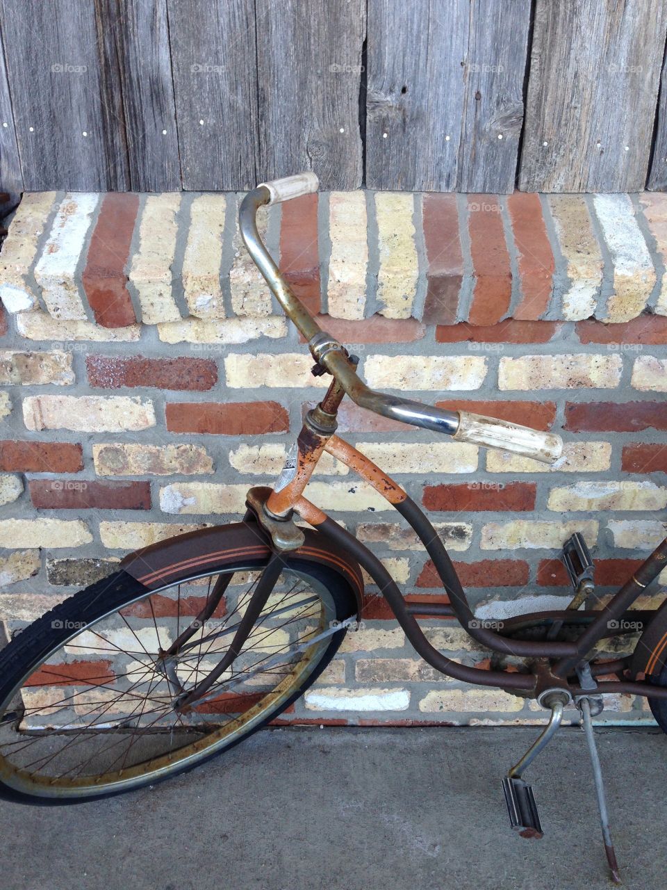 Spokes, wheels, and rusty handle bars; riding vintage bicycles in style. 