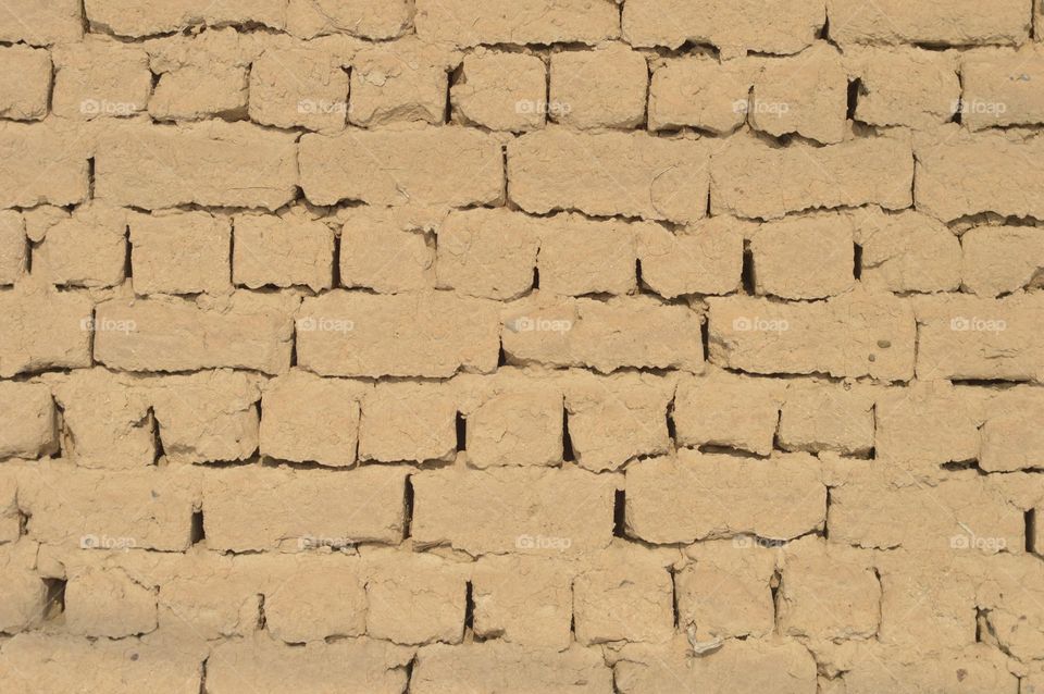 texture wall of clay unfired bricks sandstone,