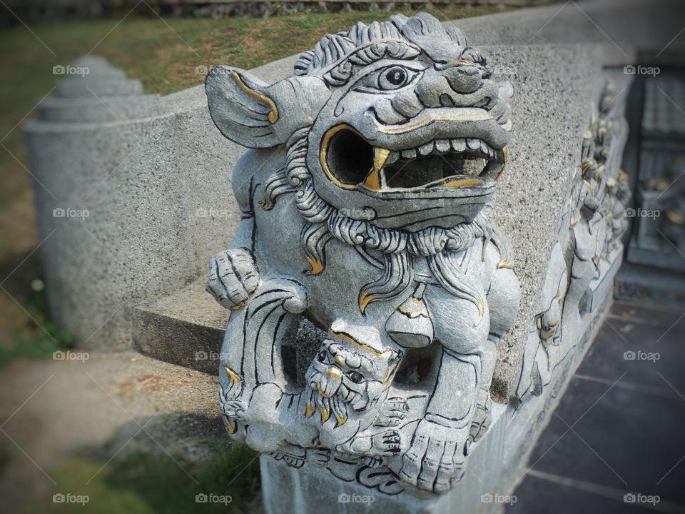 lion-shaped stone statue of fire