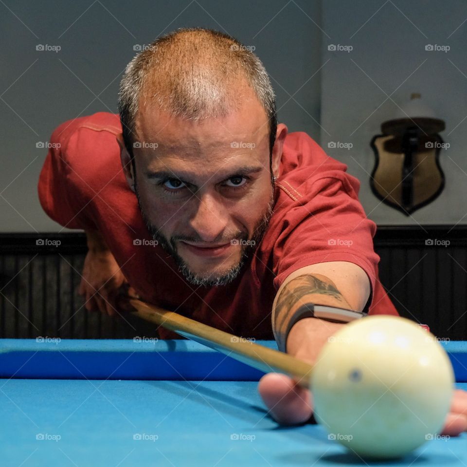 Hanging out and shooting pool with friends is a great hobby for a fun and leisurely evening. 