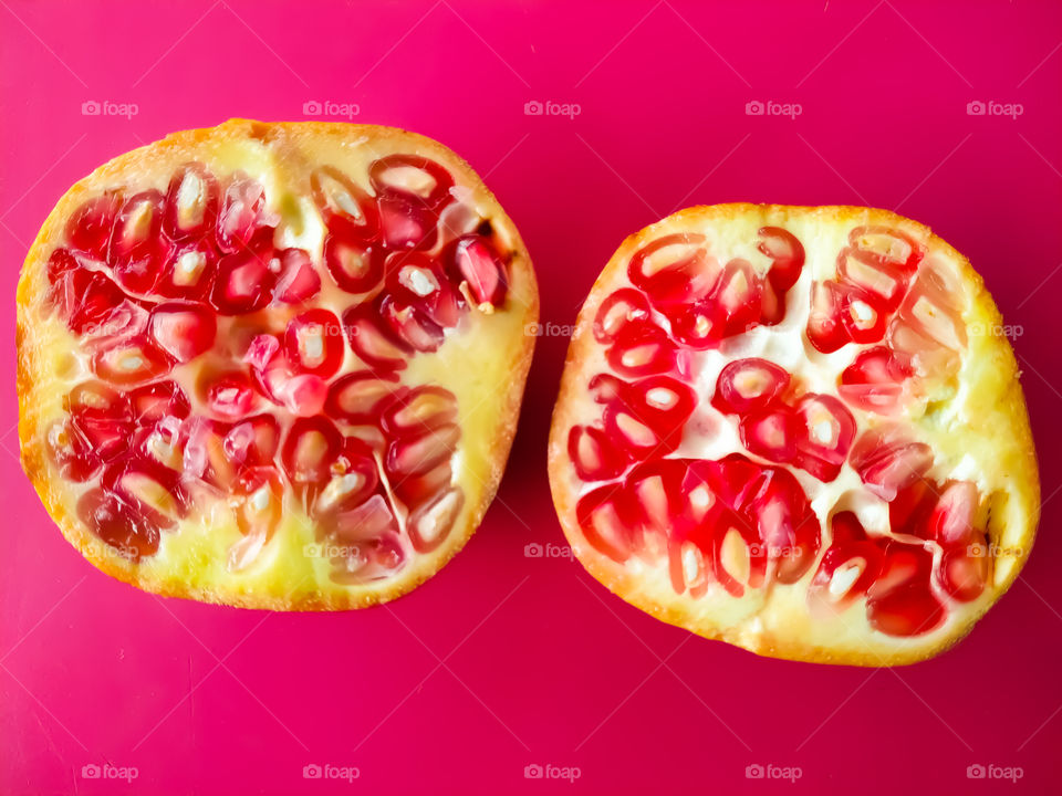 Pomegranate isolated on pink background
