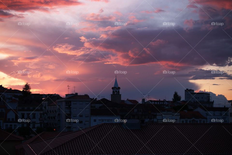 Amazing sunset over the roofs of Castelo Branco, Portugal.