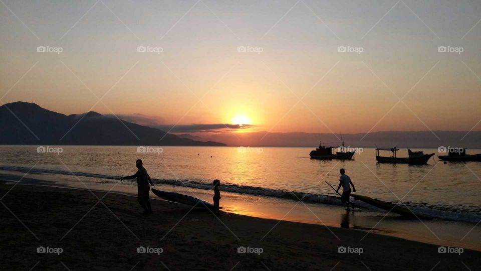 Fishermen. Fishermen at the sunset.