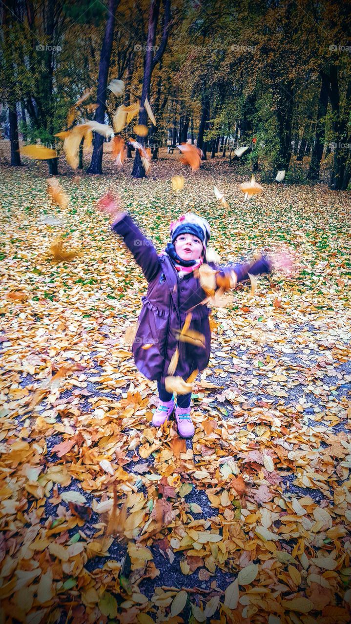 Portrait of cute girl enjoying in autumn