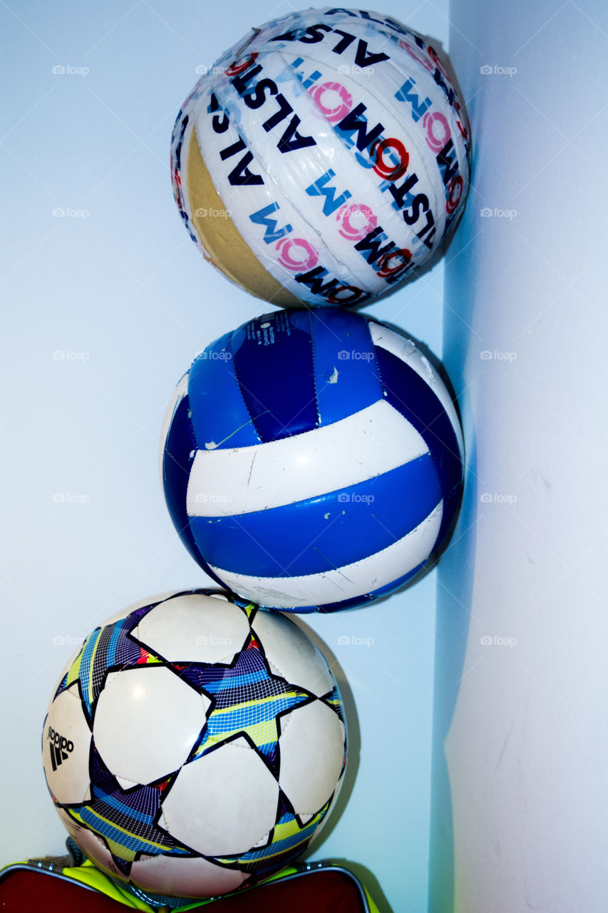 The volley ball at the top is torn away and is taped fully to look perfect inspite of its imperfections. 