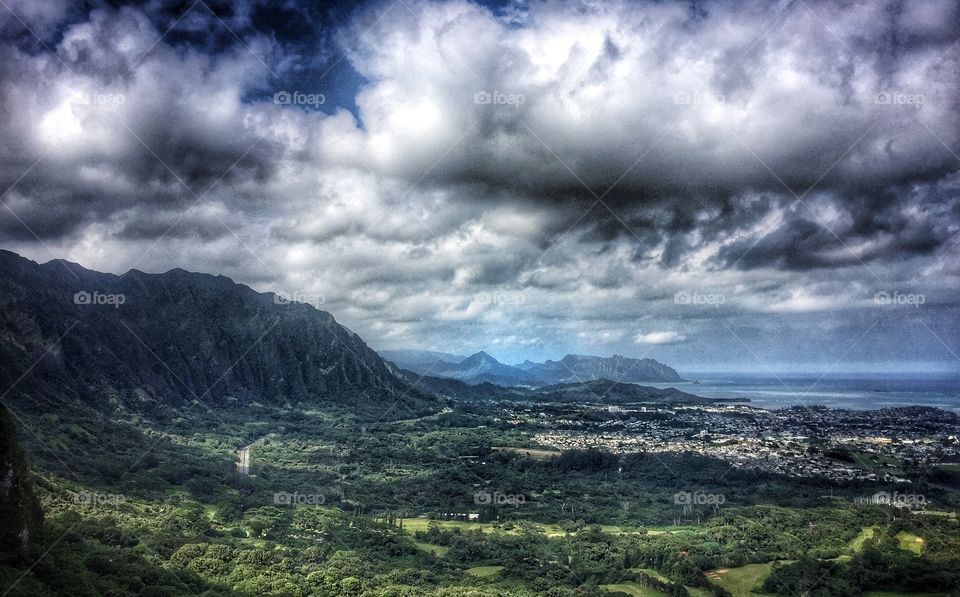 Cloudy sky against grassy land