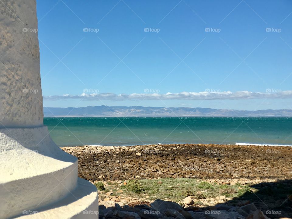 View of ocean from base of old white lighthouse, Point Lowly, South Australia 