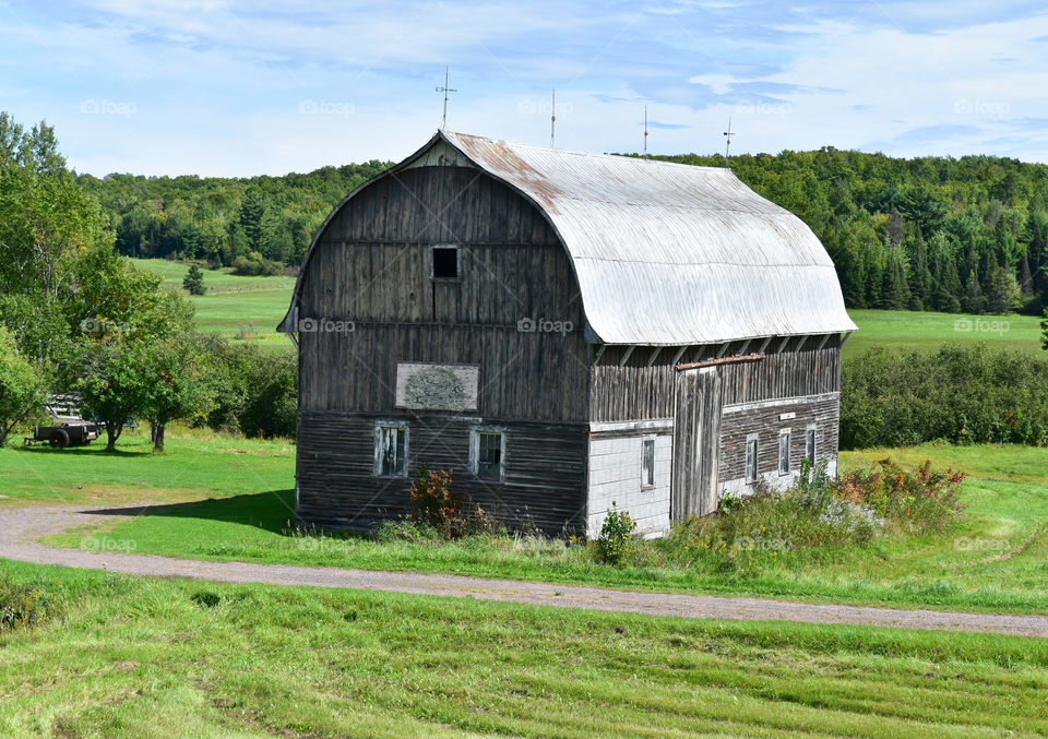 Rustic barn on sunny summer day