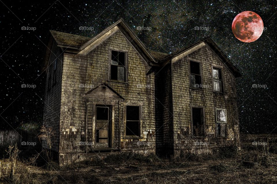 Abandoned rural house at night