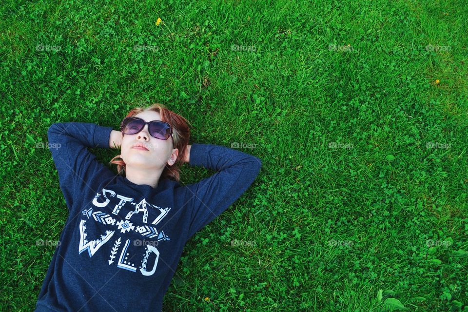 Girl relaxing in the grass