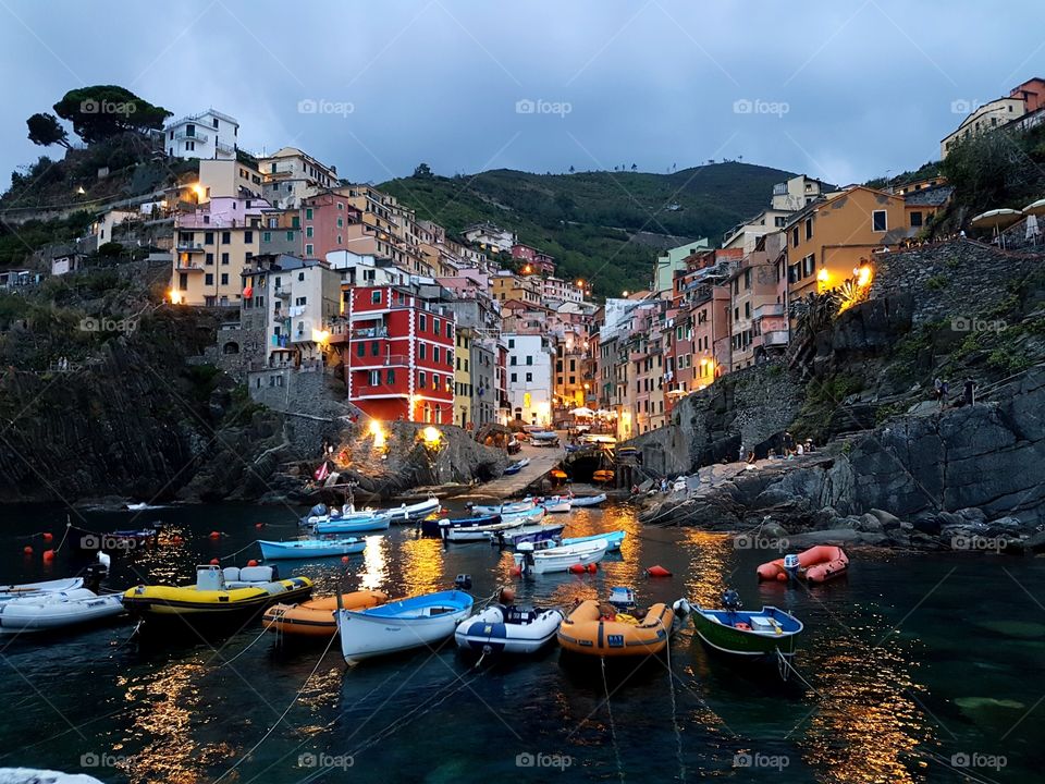 Riomaggiore view from across the harbour at sunset, Cinque Terre, Italy