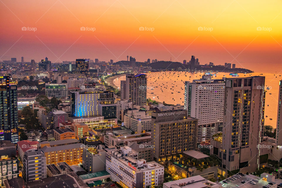 Watch the beautiful sunrise and the cityscape from a viewpoint of a rooftop terrace in Pattaya District Chonburi Thailand Southeast Asia
