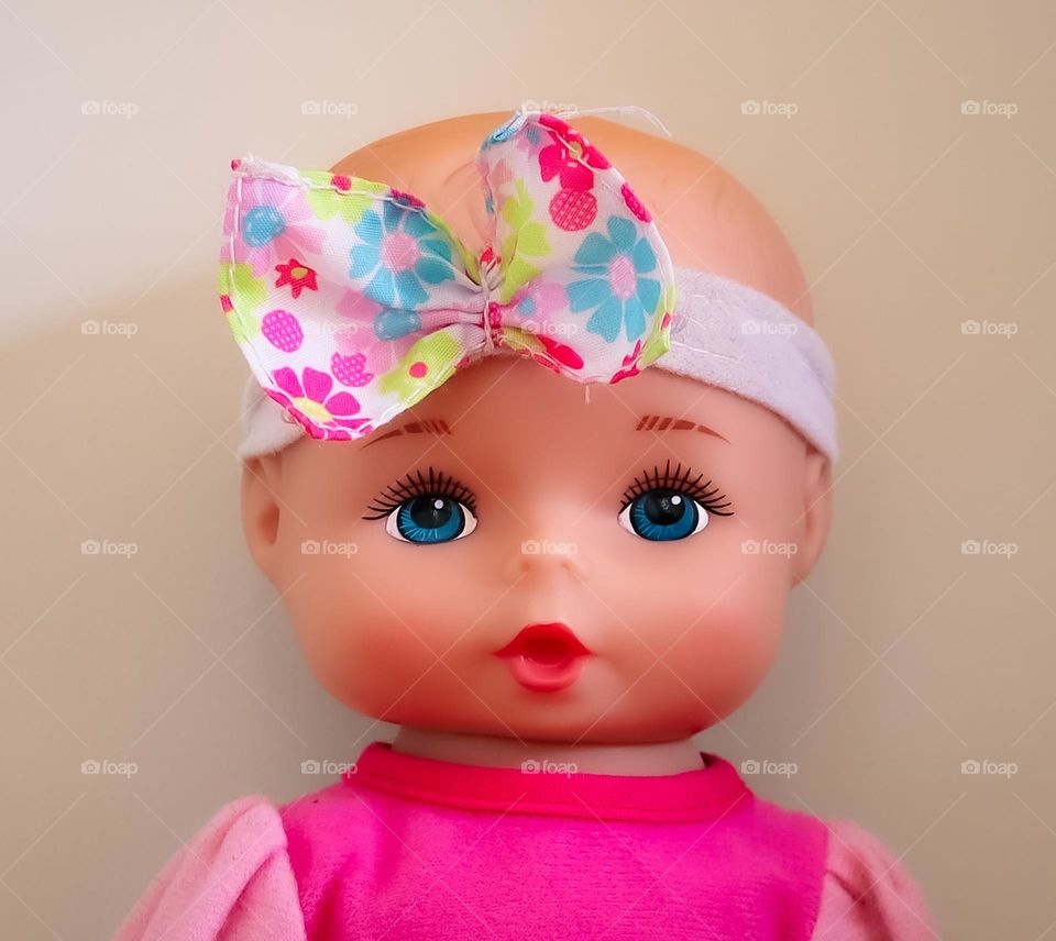 Baby girl toy with hairband