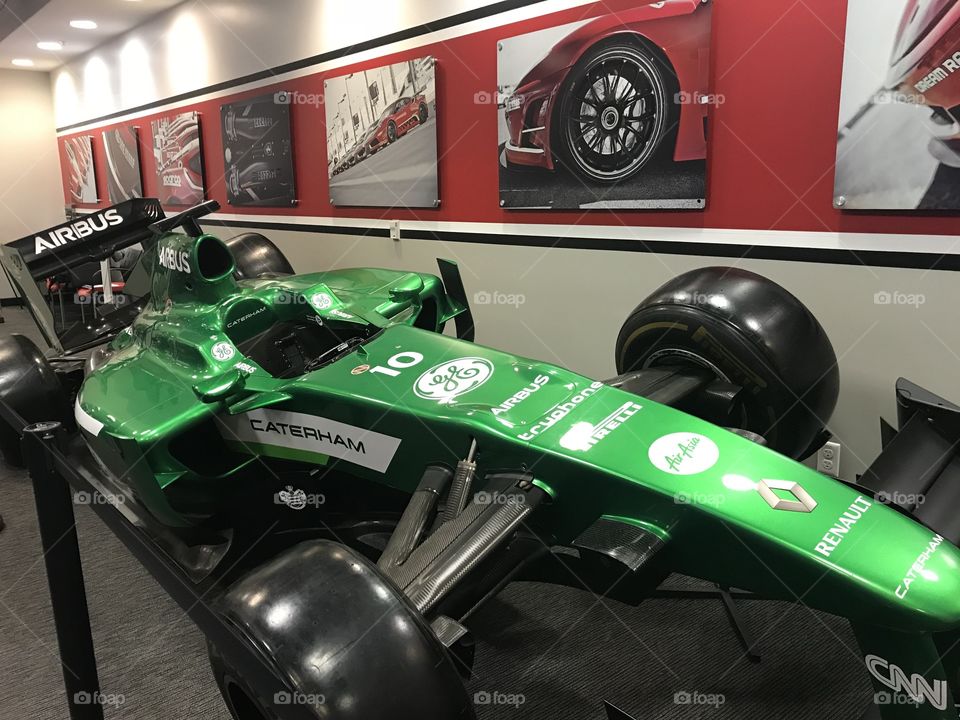 Green race car indoors