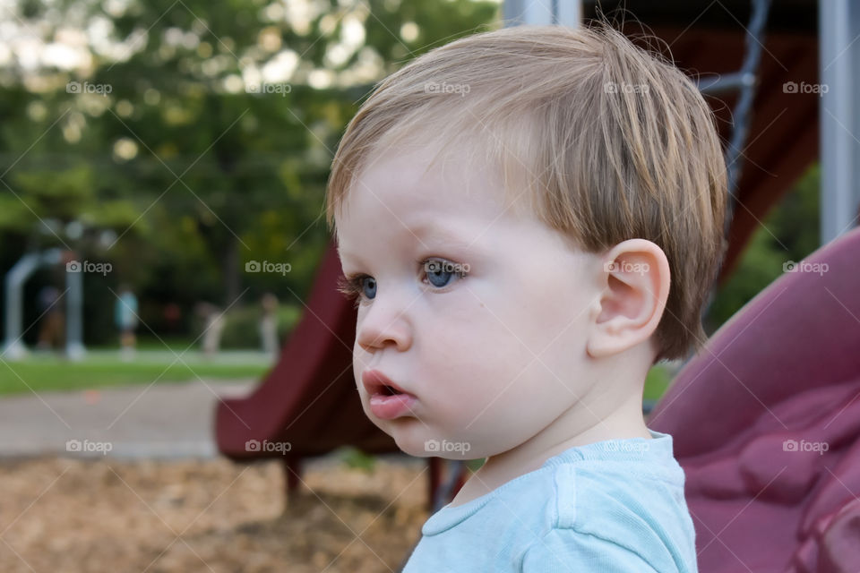 Cute curious toddler on playground 3