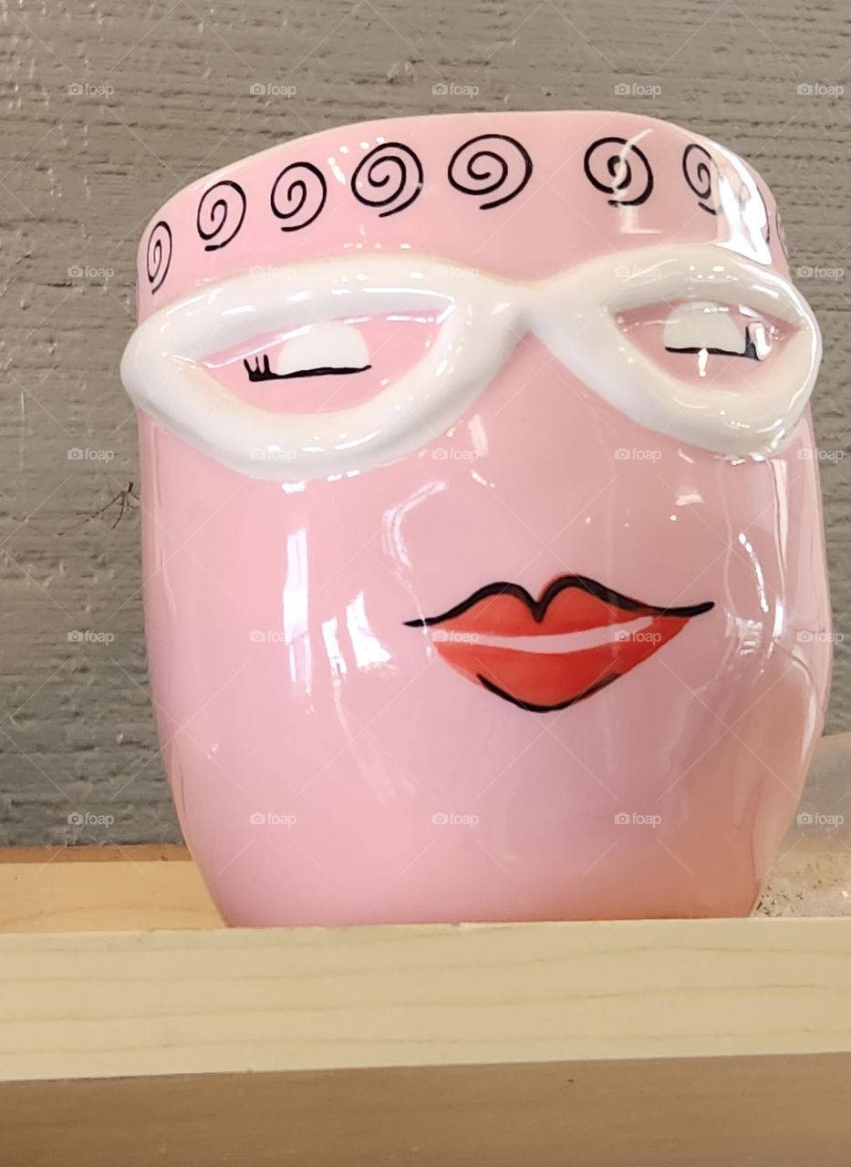 this unique ceramic flower pot found in an Oregon garden center evokes the nostalgic pink positive vibes of Barbie glam