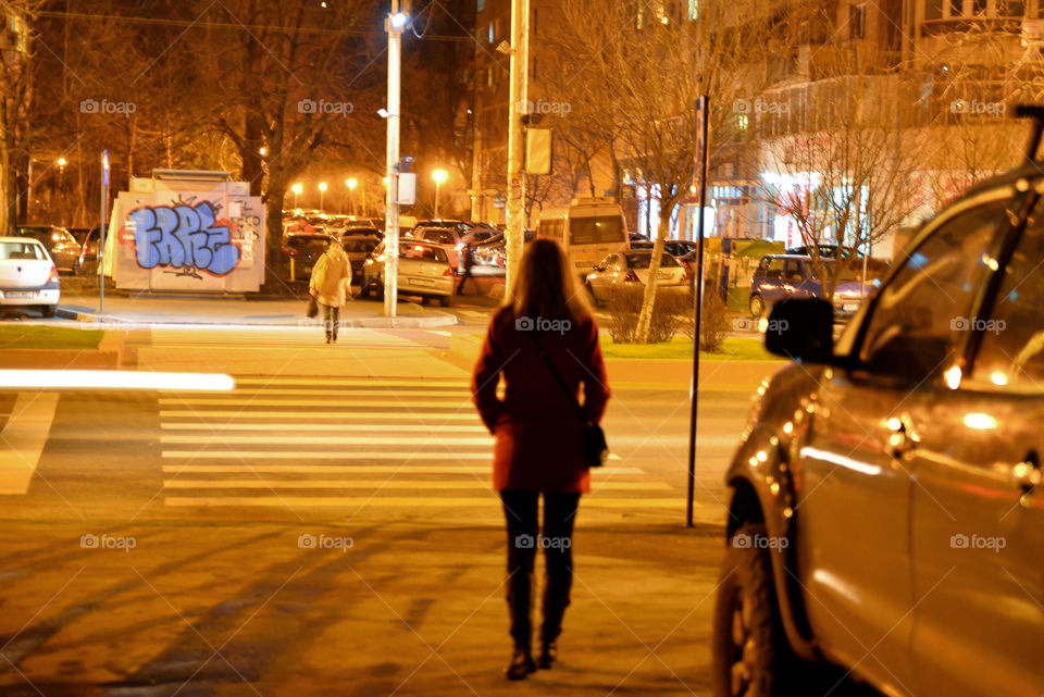 Girl waiting to cross the street