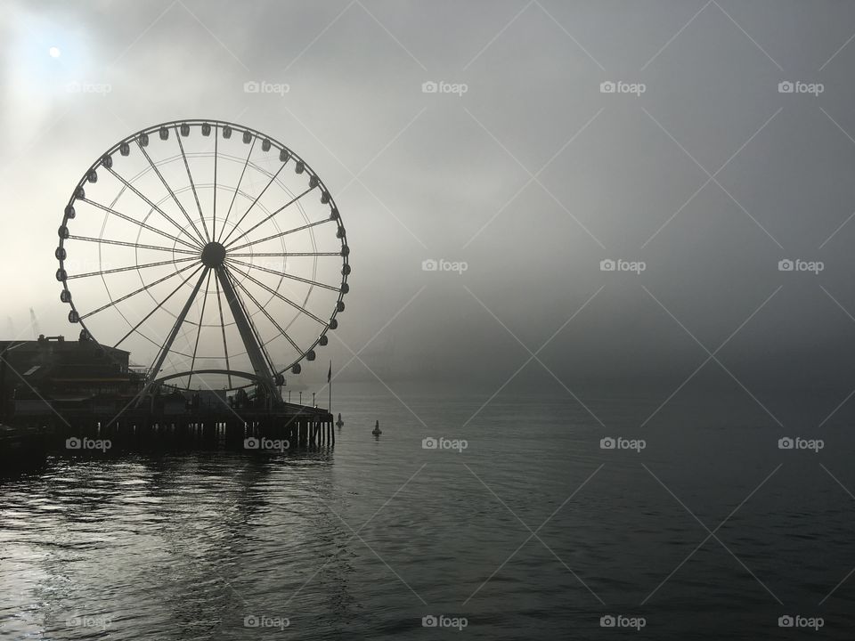 Foggy Black and White Waterfront Ferris Wheel View
