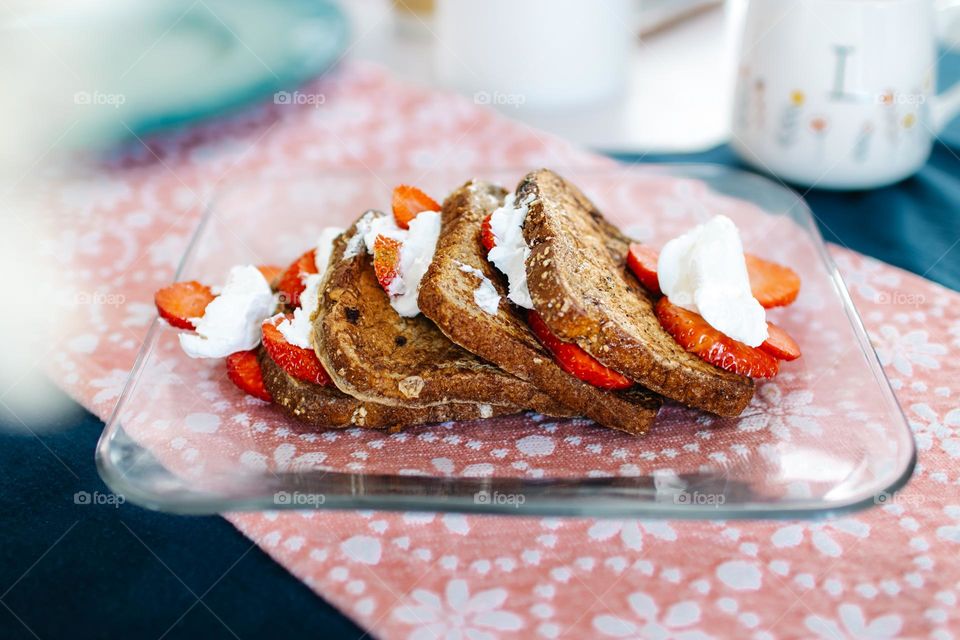 Protein French Toast with cool whip and strawberries, yum.😋