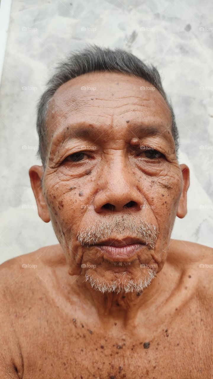 Close-up photo of Asian father's face