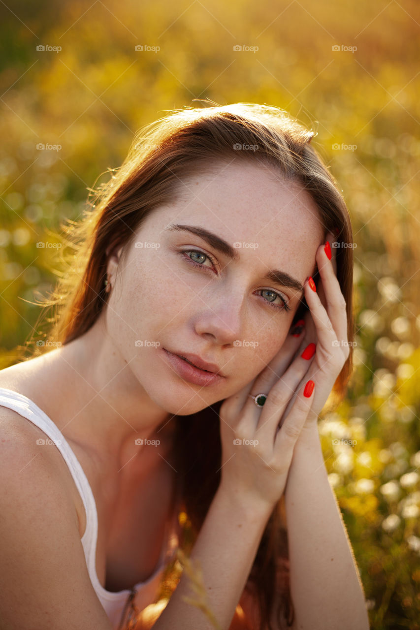 portrait photo of a young woman in nature