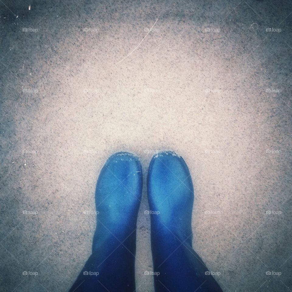 Looking down at blue boots