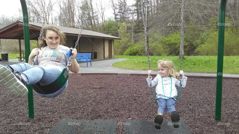 Sisters swinging