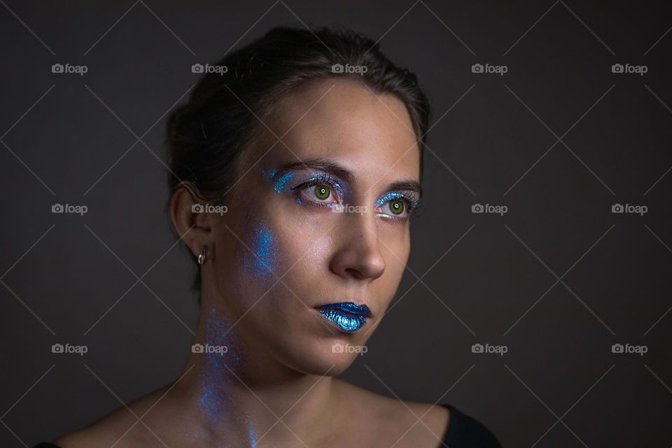 Portrait of a young woman wearing a make up 