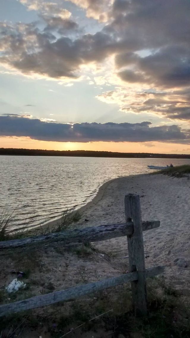 This is serenity, for me, and more.  The absolute beauty of the dimming light contrasting the distant landmass is, in my mind, spectacular.