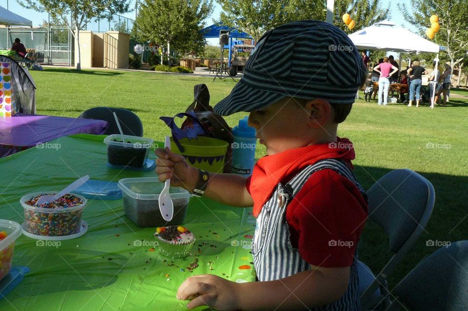 Boy with cupcakes