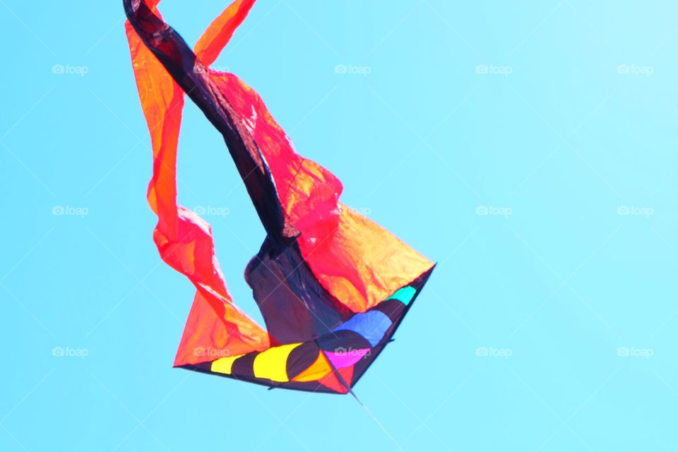 Bright colorful kite flying in the sky