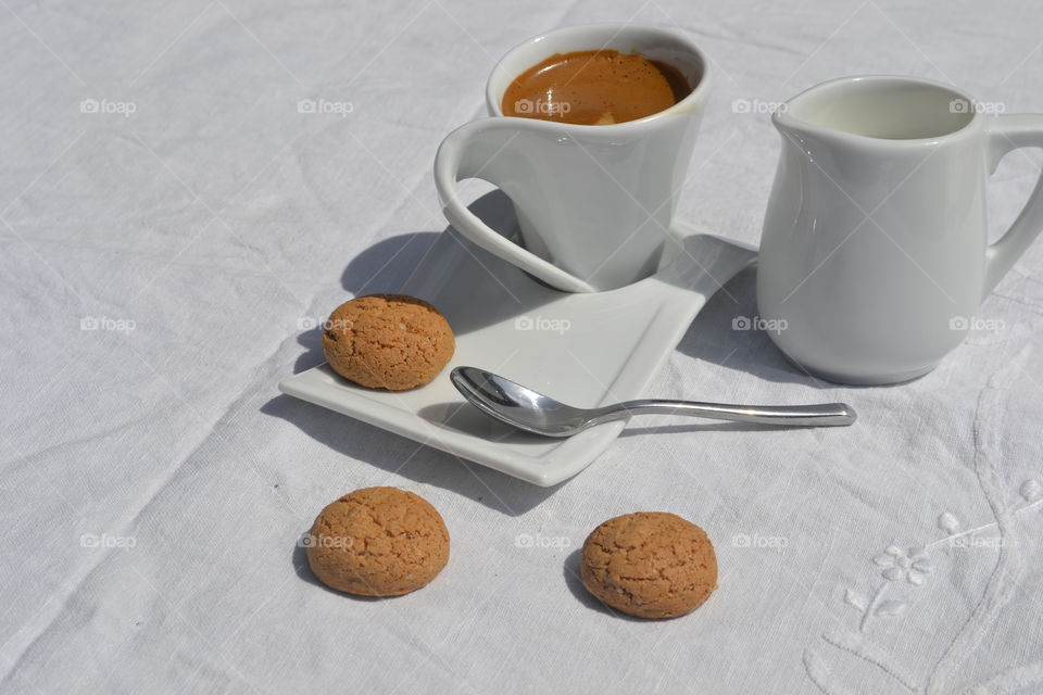 Tea in a cup with cookie