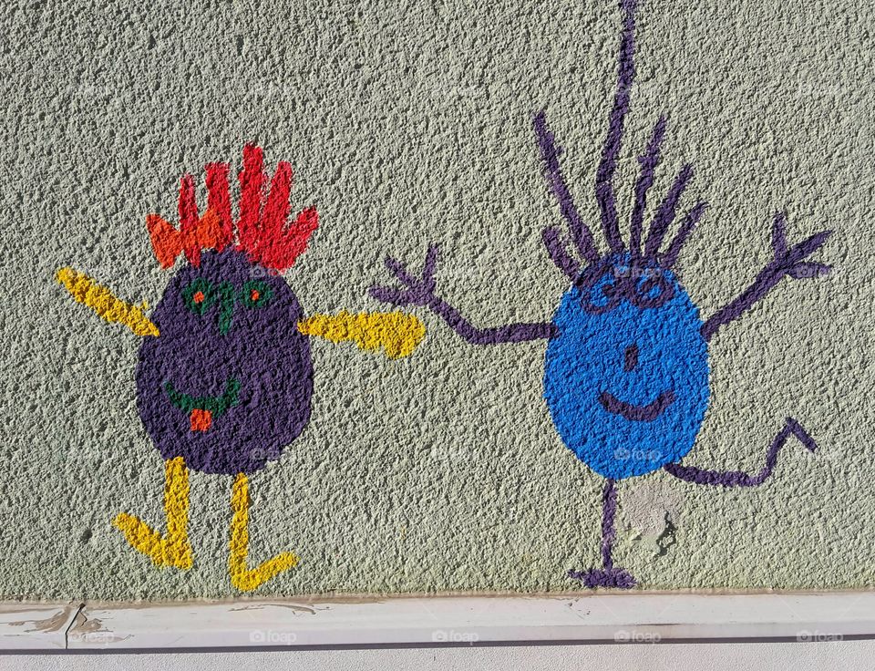 funny little guy painted on wall