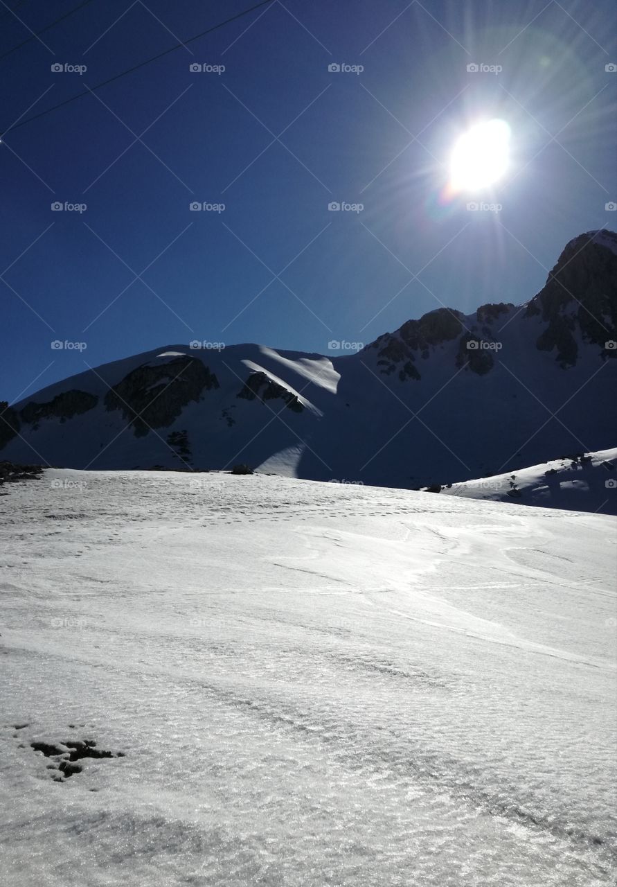 Wonderful nature: White snow, blue sky in a magic light