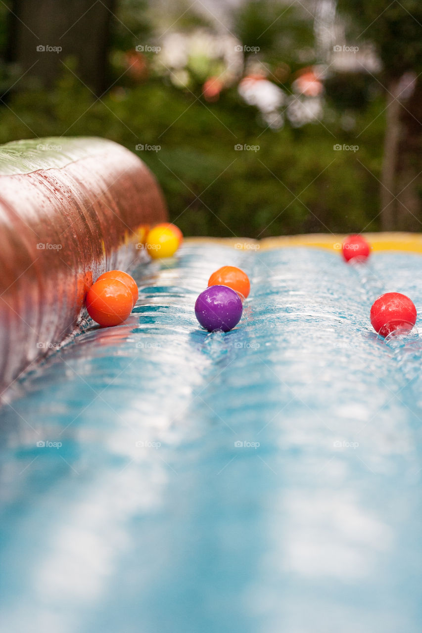 Summer memories - water slip and slide with colorful balls