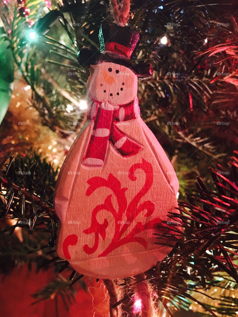 Snowman Christmas decoration on the tree. 