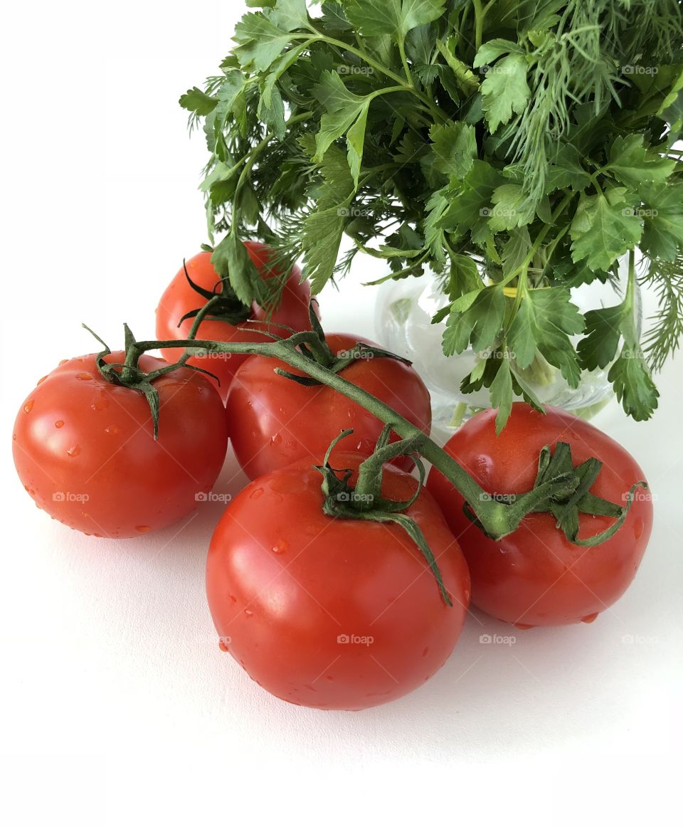 Red tomatoes on a branch 