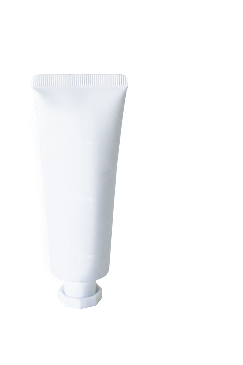 White cosmetic cream tube on a white background with clipping path.